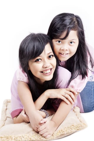 Woman And Child Smiling - Trade Winds Dental