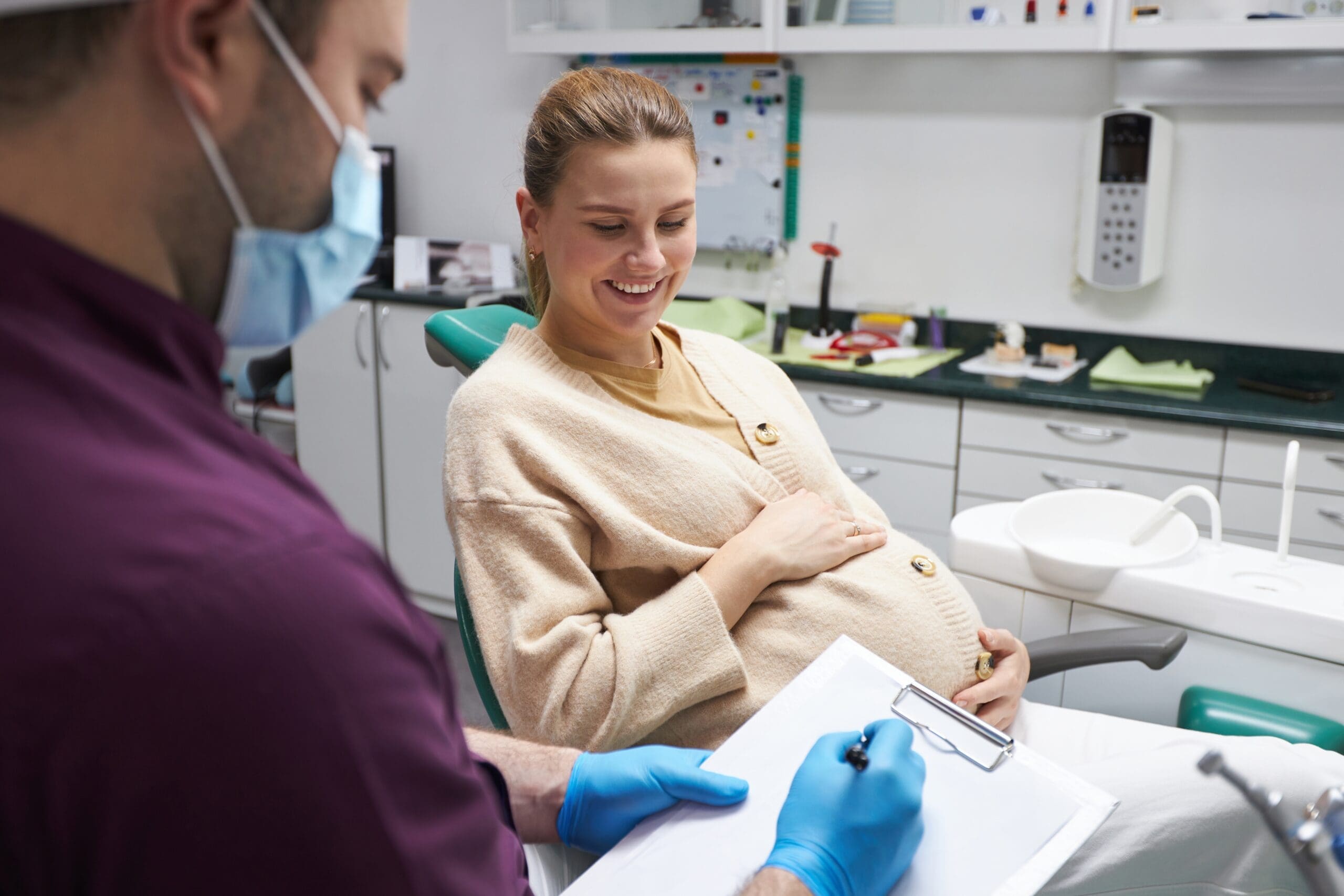 Pregnant Woman Meeting With Dentist - Trade Winds Dental