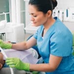 Dentist Administering Sedation Via The Nose - Trade Winds Dental
