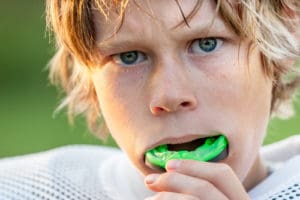 teen football player with mouthguard