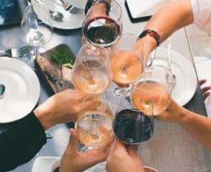 Toasting With Wine Glasses - Trade Winds Dental