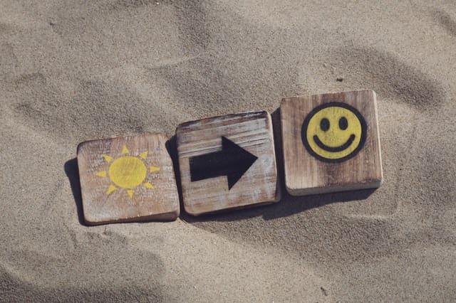 happy sun blocks in sand