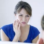 Woman With Toothache - Trade Winds Dental