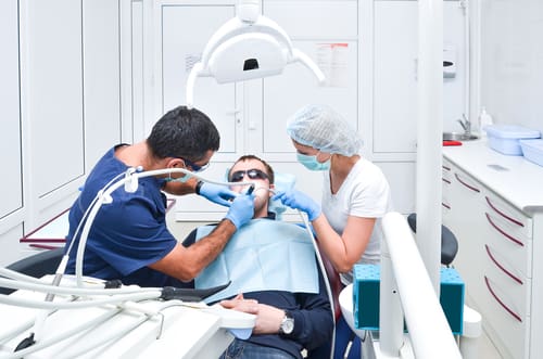 Man Undergoing Dental Procedure - Trade Winds Dental