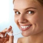 woman with Invisalign braces