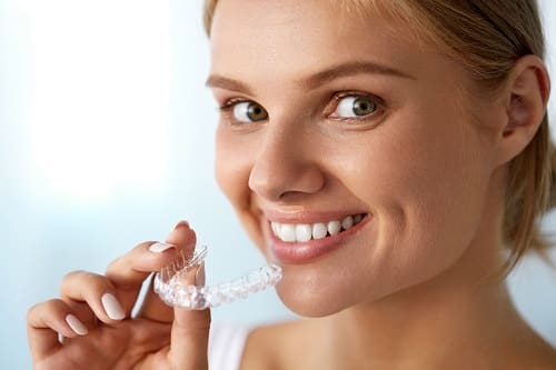 Woman With Invisalign - Trade Winds Dental