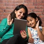 Woman And Young Girl Using Tablet - Trade Winds Dental