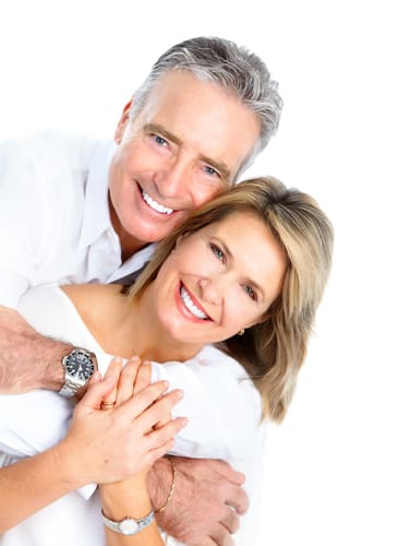Happy Senior Couple Smiling From Senior Dentistry - Trade Winds Dental