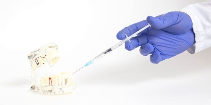 Dentist Administers Sedative Syringe To Practice Model Teeth - Trade Winds Dental